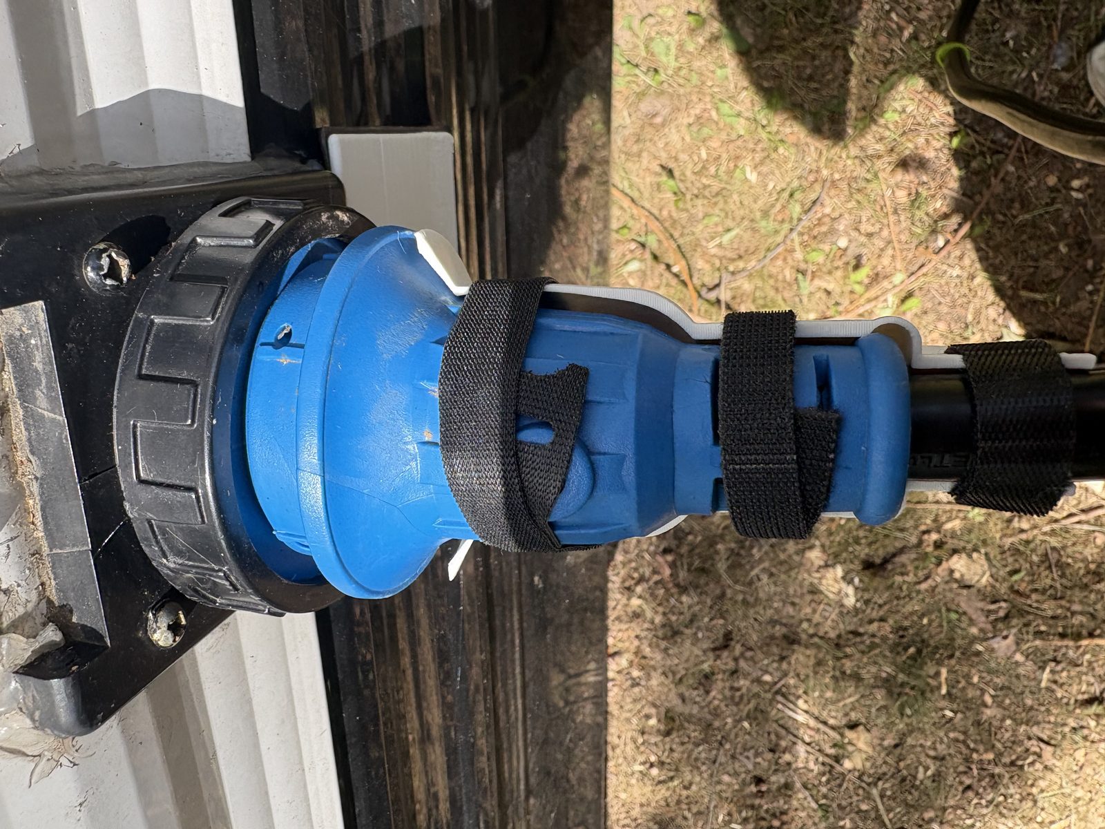 Strain Guard installed on an RV shore power connection at a campground